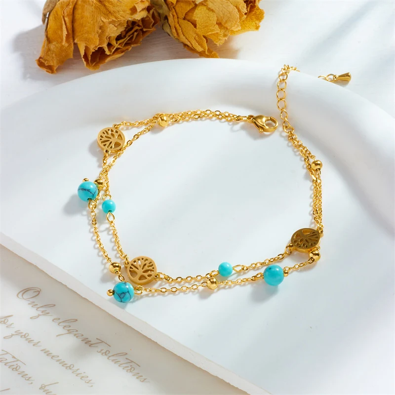 Bracelet Double Couche avec Pendentif Turquoise Arbre de Chance Connecté, un bijou porte-bonheur élégant et significatif.
