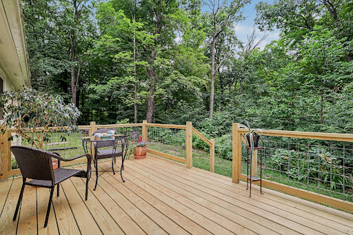 wooden deck with table and chairs in this luxury property for sale in Sharon ($499,500)