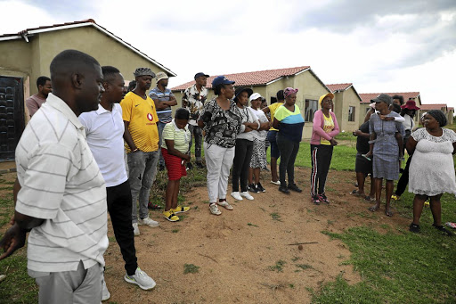 Daveyton residents outside the RDP houses they were evicted from.