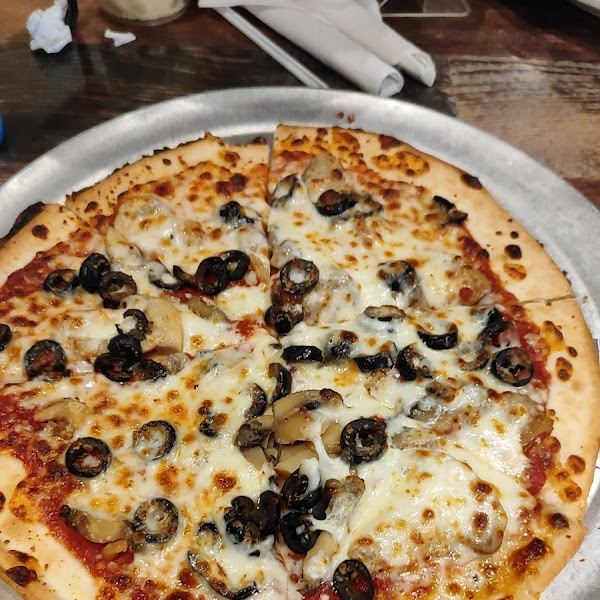 Gluten free cheese pizza with black olives and mushrooms.