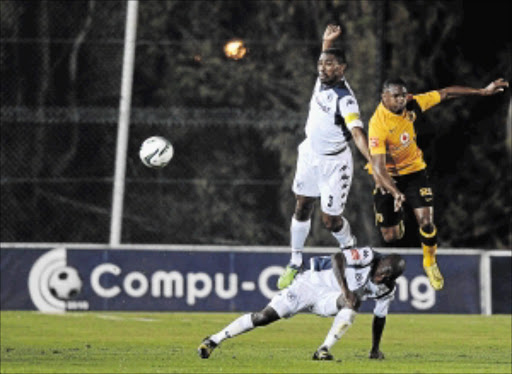 CRACKING FORM: Bernard Parker of Kaizer Chiefs battling for the ball with Thulani Hlatshwayo and Phumlani Ntshangase of BidVest Wits during their Absa Premiership match at the Milpark Stadium in Johannesburg last night Photo: Gallo Images