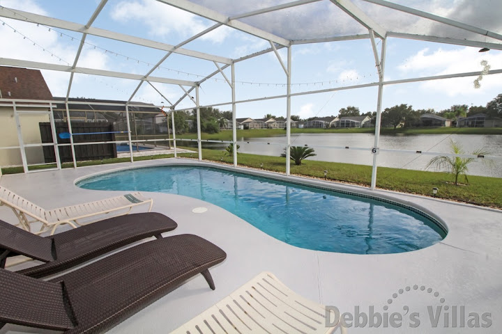 Orlando rental villa with a lake view from the south-facing private pool