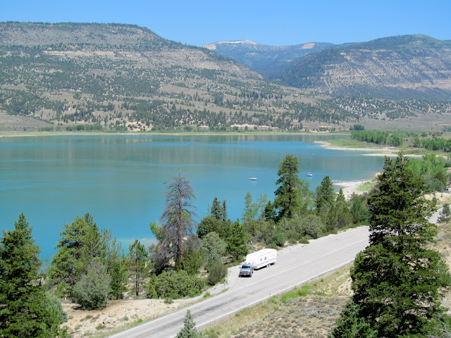 Truck and trailer parked near the reservoir