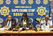 Deputy police minister Cassel Mathale, national police minister Bheki Cele and national commissioner general Khehla Sithole at a briefing in Durban on Tuesday. They addressed the media about festive season crime stats.