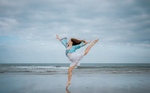 Girl dancing on the beach