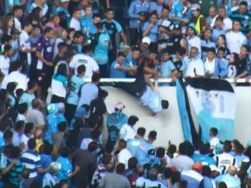 Emanuel Balbo (centre) was pushed over the edge of a stand on Saturday. AGENCIES