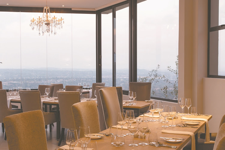 Large frameless windows make the most of the expansive city views from Kranz Restaurant at The Northcliff.