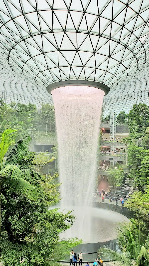 Visiting Changi Airport in Singapore: the famous HSBC Rain Vortex and the surrounding Shiseido Forest Valley - four stories of greenery surrounding the world's tallest indoor waterfall