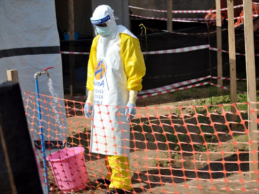 A medical worker wears a protective suit as he prepares to administer Ebola patient care at The Alliance for International Medical Action (ALIMA) treatment center in Beni, North Kivu province of the Democratic Republic of Congo September 6, 2018. /REUTERS