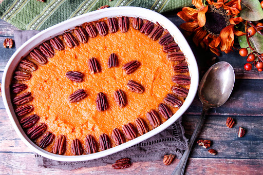 Aunt Dianna's Bourbon Sweet Potatoes with pecans on top.