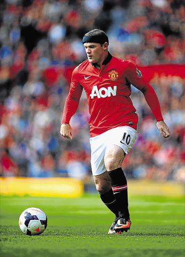 HEAD CASE: Wayne Rooney of Manchester United wears protective headwear during the English Premier League match against Crystal Palace at Old Trafford on Saturday.