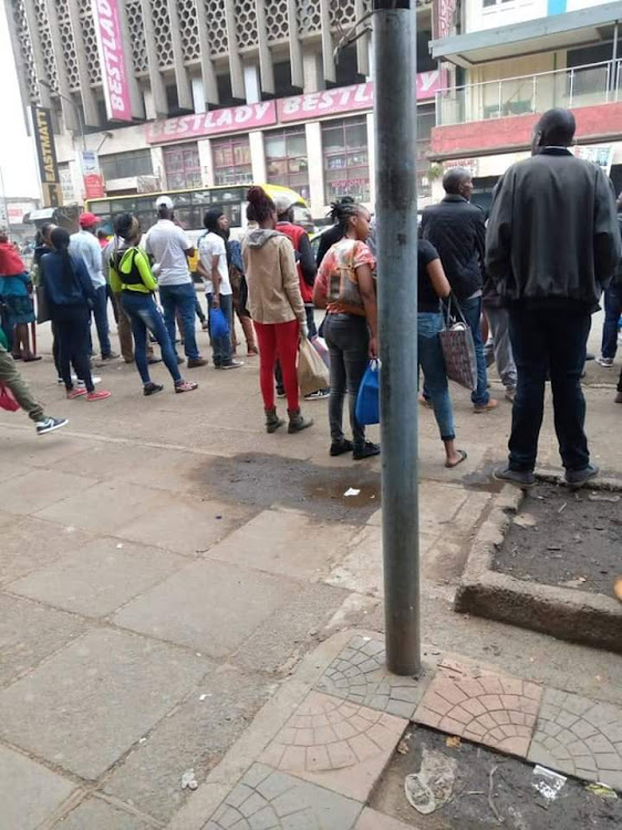 Residents in Nairobi getting ready to go home before the curfew.