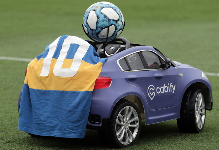 A remote control car is seen with Diego Maradona jersey as a tribute