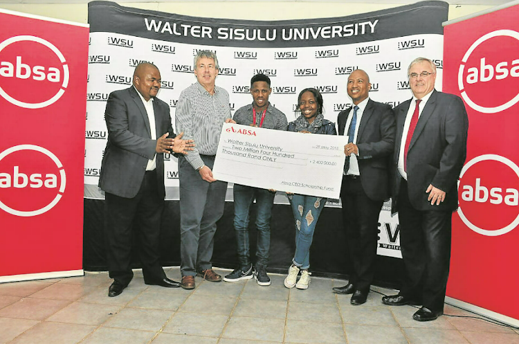 From left, are Thembi Klaas, Absa provincial manager, Mark Rosslee of WSU, students Yandisa Ntengenyane and Sanelisiwe Dlepu, Xolisa Kalimashe, Absa’s area head in Mthatha and Louis van Aswegan, head of Absa’s customer network