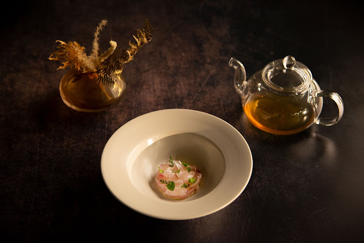 Line fish sashimi, uni chawanmushi, foraged herbs, accompanied by a mirin and fish-broth tea.