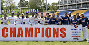 The Sri Lanka cricket squad players celebrate with the trophy after winning their two-match test series against Bangladesh 1-0. 