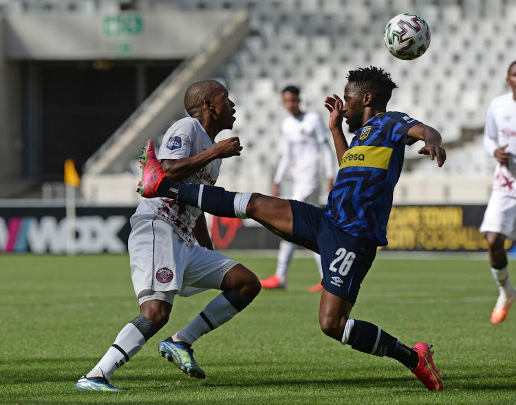 Lebohang Mokoena of Swallows FC evades a challenge from Mduduzi Mdantsane of Cape Town City during the DStv Premiership 2020/21 game between Cape Town City and Swallows FC at Cape Town Stadium on 21 February 2021