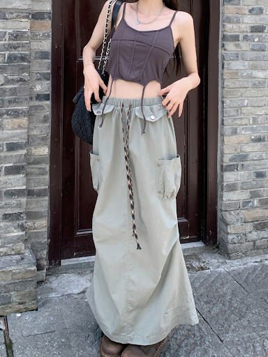 Title 19, A Woman Wearing A Suspender Vest With A Chest Pad.