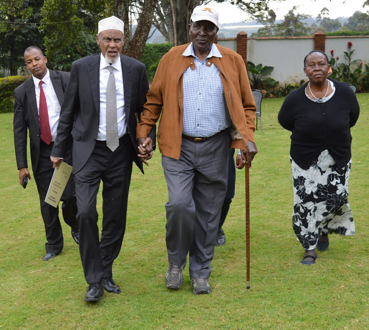 Building Bridges Initiative chairman Yusuf Hajji with ailing Kiambu politician Nginyo Kariuki in Tigoni, Limuru on Monday August 12, 2019