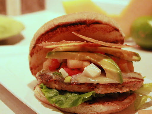 Chorizo-Chicken Burgers with Cantaloupe-Lime Salsa and Parmesan Frico Chips.