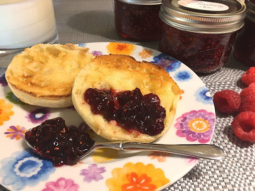 Raspberry jam spread on English muffins.