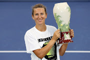 Victoria Azarenka of Belarus poses with the winner's trophy during the Western & Southern Open at the USTA Billie Jean King National Tennis Center on August 29, 2020 in the Queens borough of New York City. Her opponent, Naomi Osaka of Japan, withdrew before the start of their final match. 