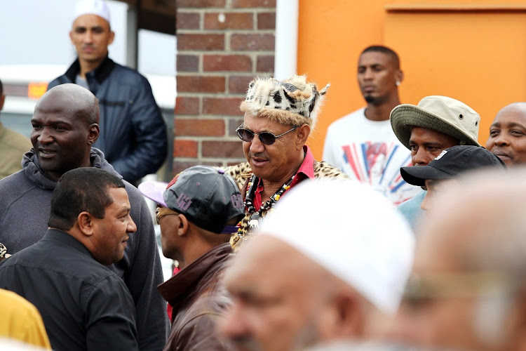 Jerome Booysen (bottom left) with alleged former gang boss Ernie Solomon (centre) at the 2016 funeral of murdered Cape Town defence lawyer Noorudien Hassan.