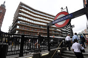 An office building containing the London headquarters of the PR company Bell Pottinger is seen behind an entrance to an underground train station in London, September 5, 2017. 