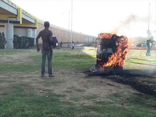 A fire lit in Kindele area, Kisumu, in opposition to the repeat presidential election, October 26, 2017. /FAITH MATETE