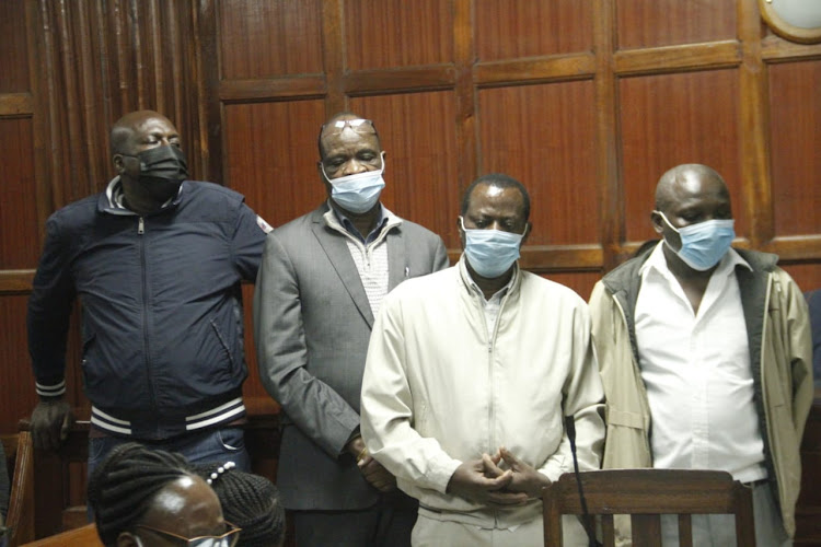 Former Kayole chief Alexander Hoops, Patrobas Awino, Peter Gitau and Peter Njoroge before a Nairobi court on August 6, 2021 where they were charged with Sh944 million land fraud