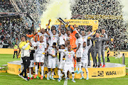 Pirates celebrate winning the MTN8 final match between AmaZulu FC and Orlando Pirates at Moses Mabhida Stadium on November 05, 2022 in Durban, South Africa. 