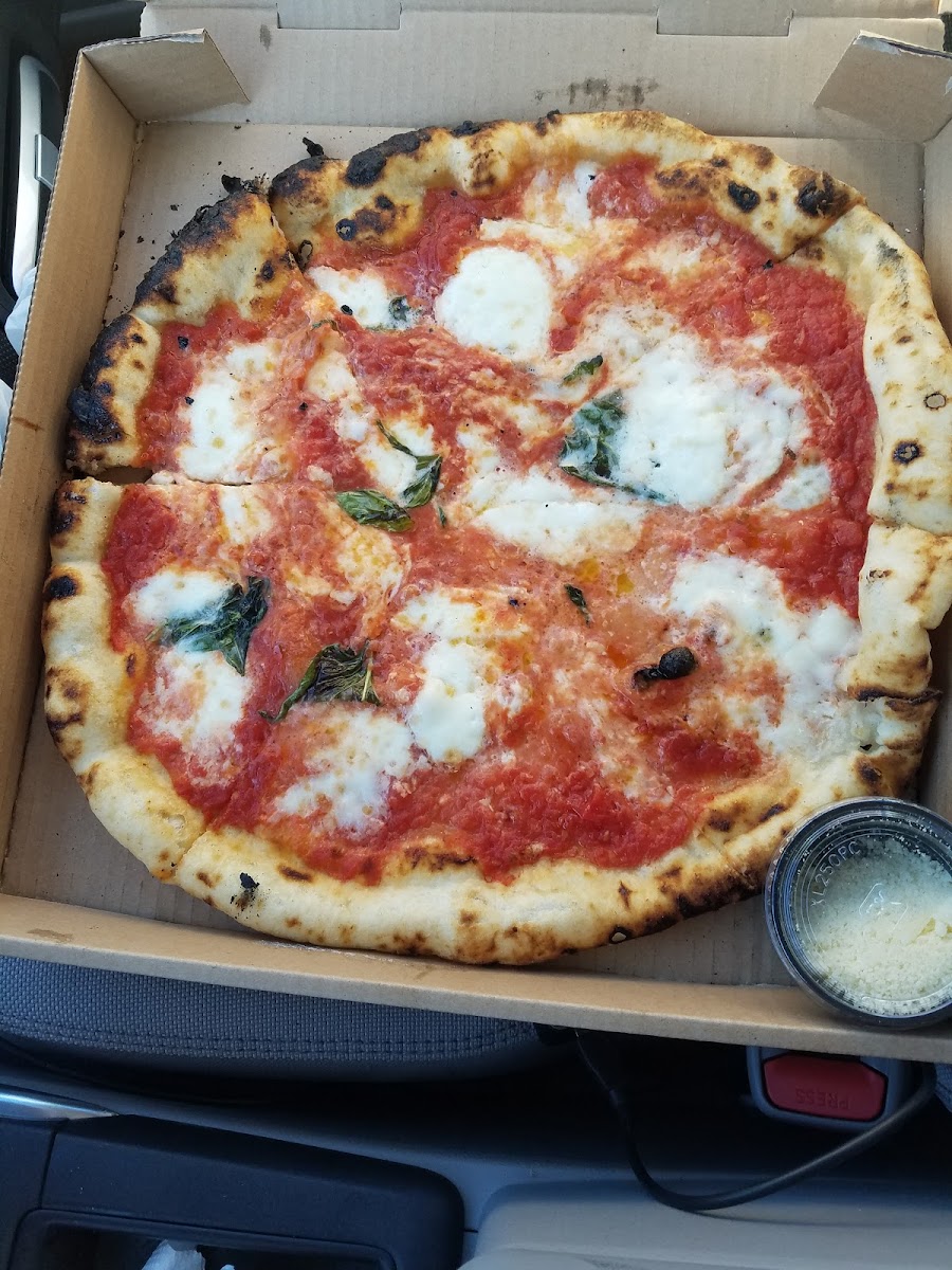 Margherita DOC

Crushed Tomatoes, Fresh Buffalo Mozzarella, Basil, Parmigiano Reggiano, Extra Virgin Olive Oil. This pizza was so good I had it twice in two days!