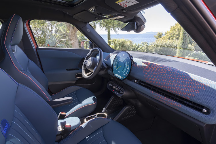 Simple but tech-rich interior sports a large OLED display.