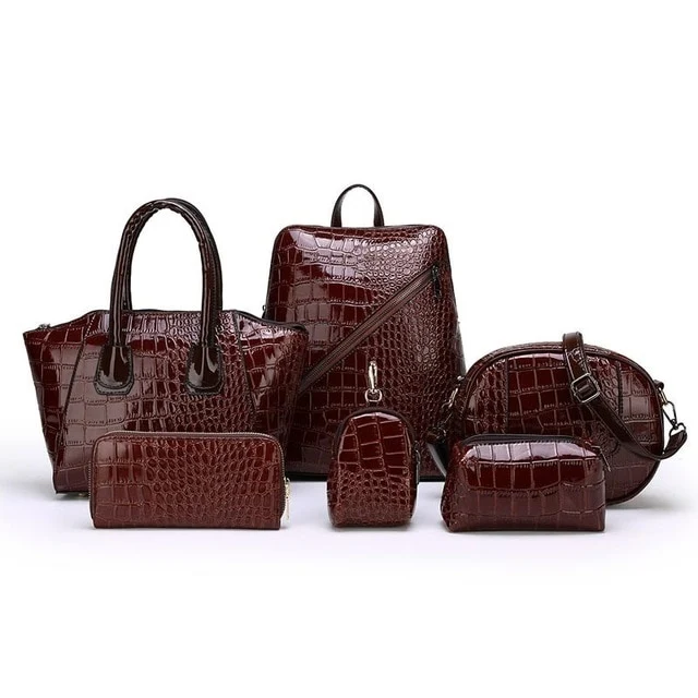 Sac bandoulière six pièces en cuir souple avec smiley. Portez l'essentiel avec style et profitez d'un confort optimal au quotidien.
