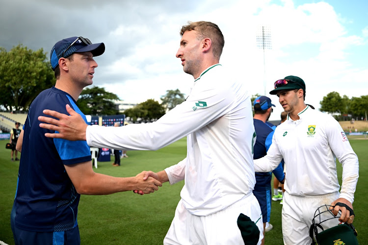 New Zealand bowler Matt Henry is congratulated by Proteas skipper Neil Brand after the Black Caps won the second Test at Seddon Park on on Friday.