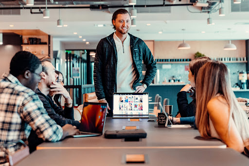 Photo of team at work in a busy office, copyright unsplash.com