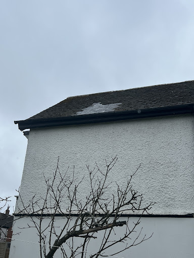 Chimney removed . Then new batons and slates