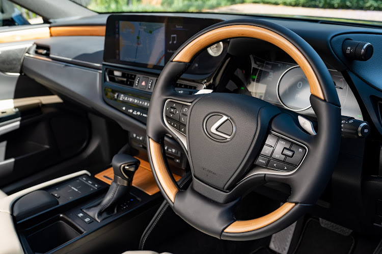 The infotainment now has a touch screen, while the top-range model gets wood veneers on the steering wheel and dash. Picture: SUPPLIED