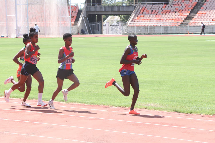 Naomi Cheptoo leads the pack in the U-20 girls' 5,000m race during the East Africa Athletics Championships.