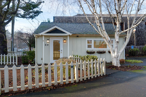 Small house with white fence and white tree in this luxury house for sale in Cannon Beach ($998,000 - 120 m²)