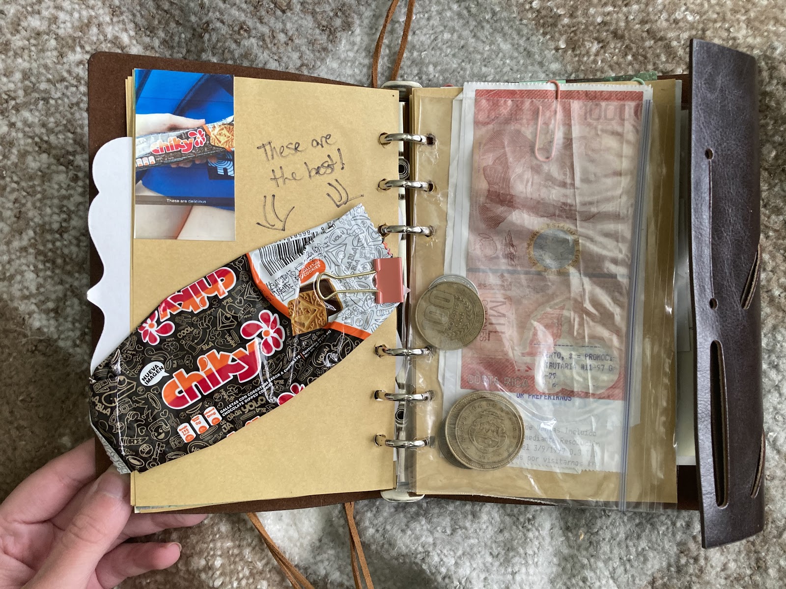 journal spread with a wrapper and coins