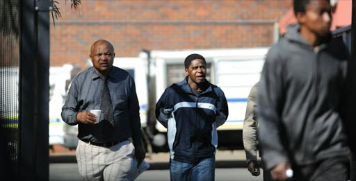Thapelo Motseki, right, leaving the Protea Magistrate’s Court during his trial. File photo.