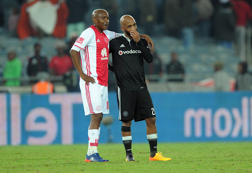 Orlando Pirates captain Oupa Manyisa (R) with Lebohang Mokoena of Ajax Cape Town during the Absa Premiership match at Orlando Stadium on May 17, 2017 in Johannesburg, South Africa.