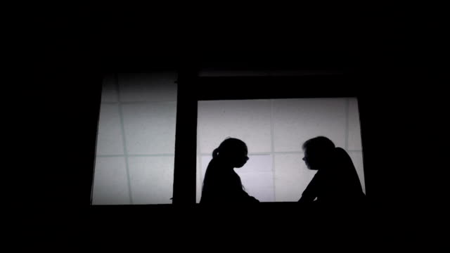 Silhouette of a couple fighting