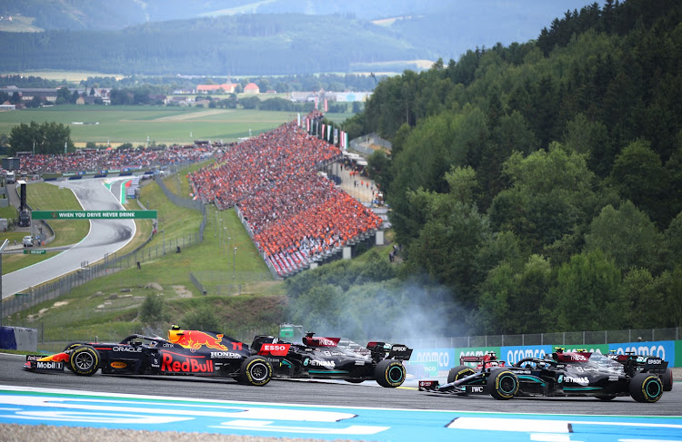 Red Bull's Sergio Perez pulls ahead of Mercedes's Lewis Hamilton during the Austrian Grand Prix at the Red Bull Ring in Spielberg, Styria, Austria. REUTERS/LISI NIESNER