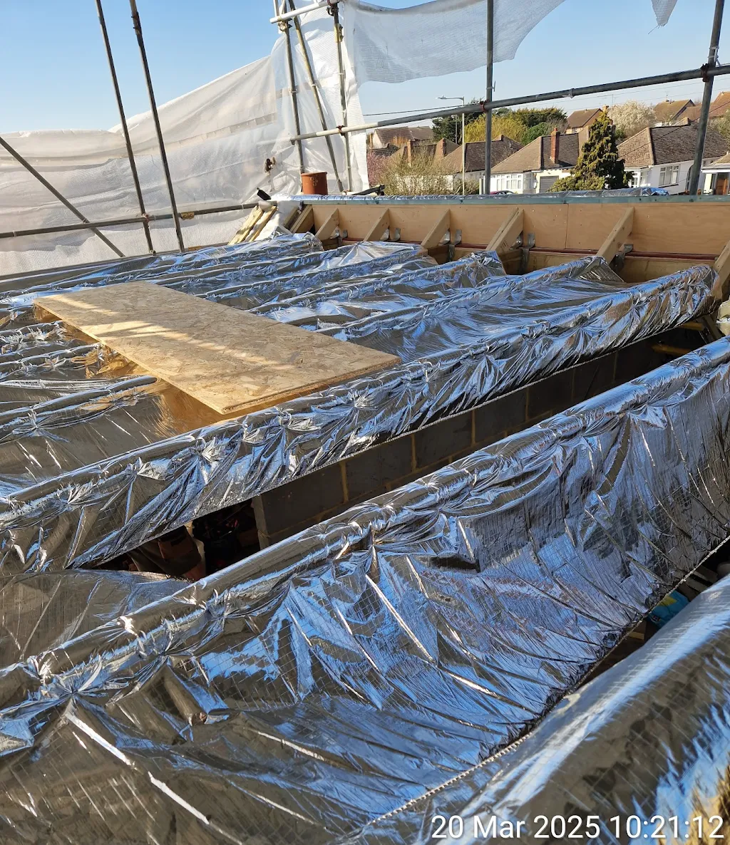Flat roof insulation in progress