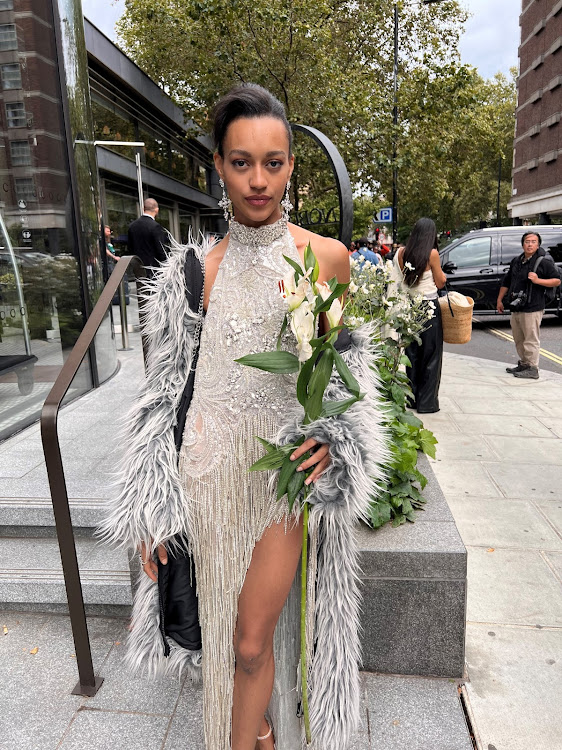 “Made In Chelsea” star Paris Smith, who is part South African, poses outside the Ashish SS24 Runway Show for London Fashion Week.