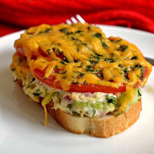 These family friendly open faced sandwiches are a tasty combination of tuna salad, tomato and cheddar cheese toasted to scrumptious perfection.