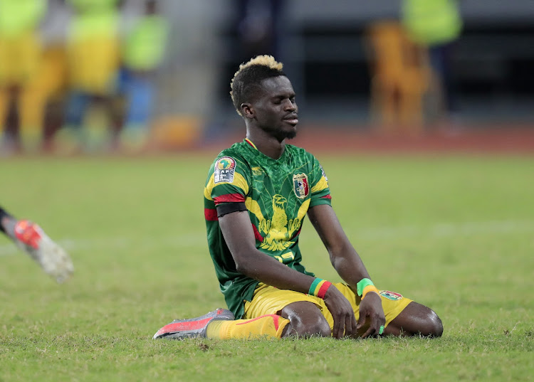 Mali's Falaye Sacko looks dejected after his final penalty was saved by Equatorial Guinea's Jesus Owono