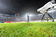 A file photo of the general view of Loftus Stadium pitch during a heavy downpour of rain.  